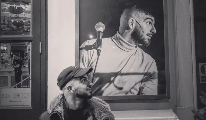 Nima Taleghani with his poster